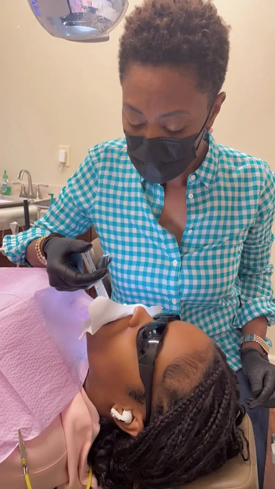 Patient receiving professional teeth whitening treatment