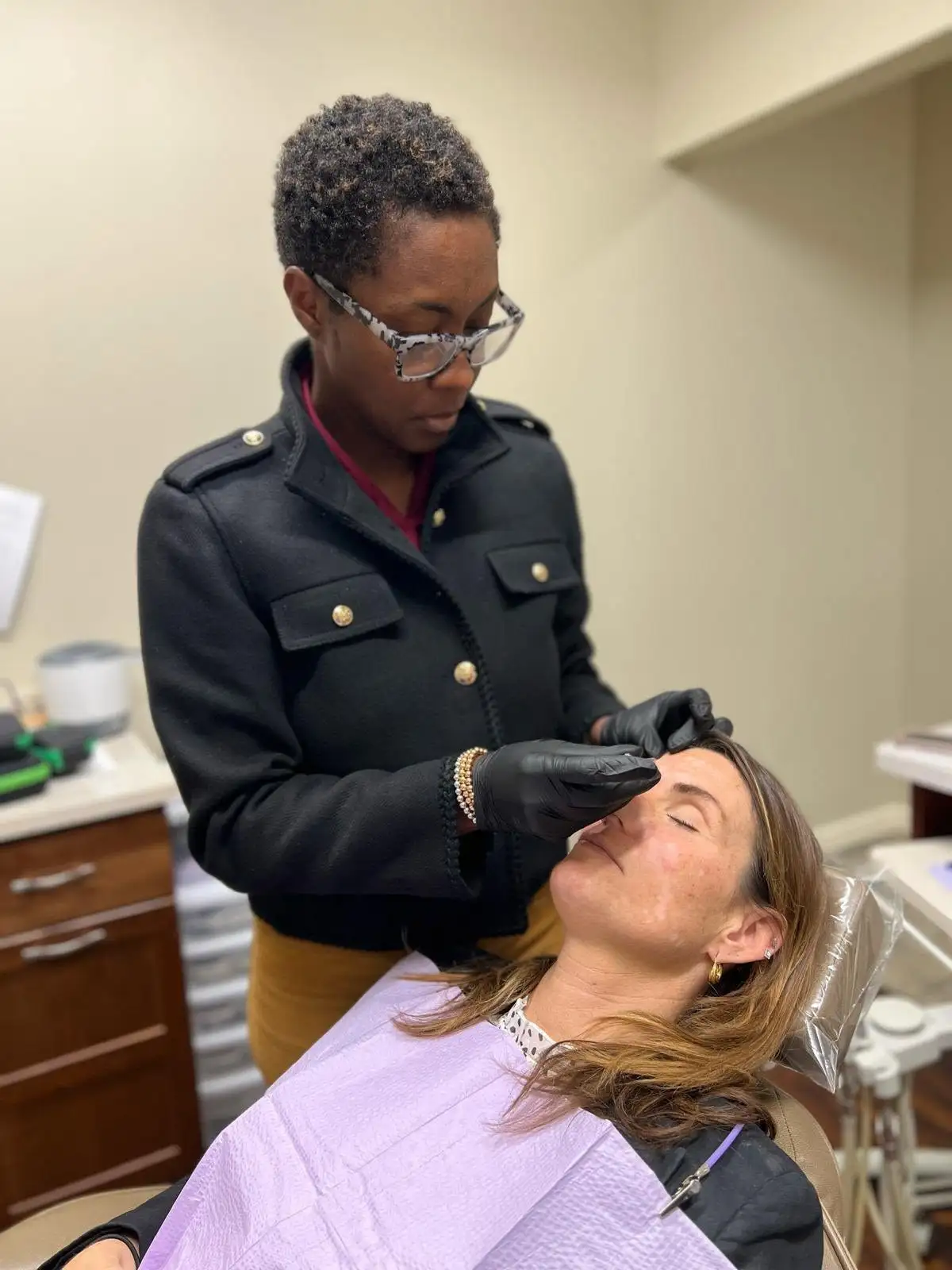 Dr. Nelly Silva, DMD treating a patient