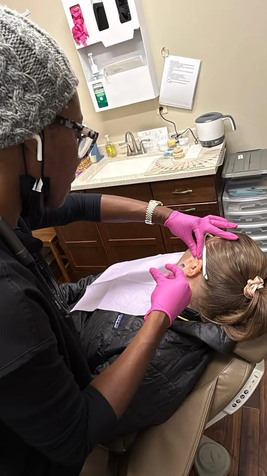 Clinician administering dermal filler treatment to a patient