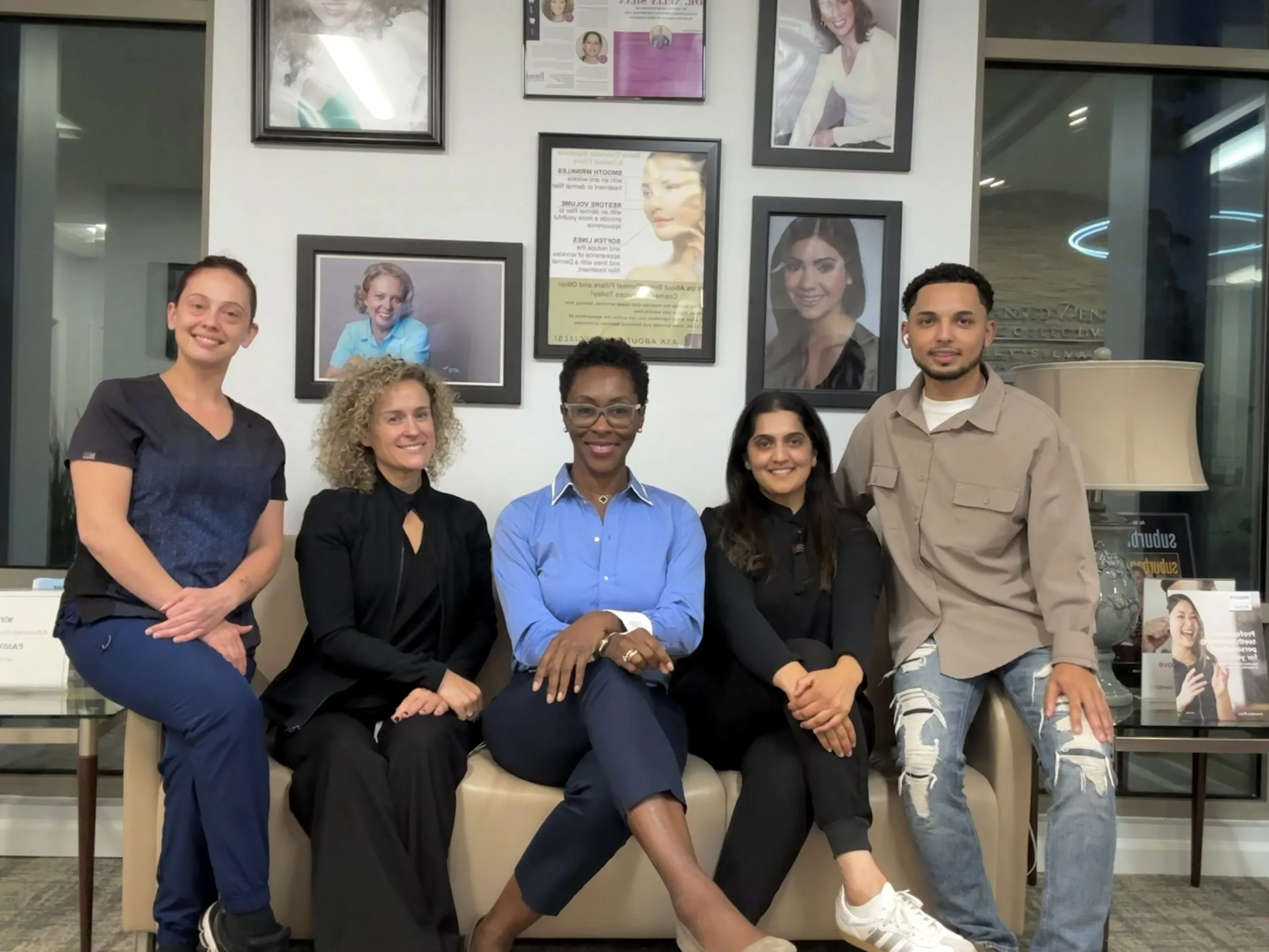 Dental team sitting together in the Collegeville office waiting room