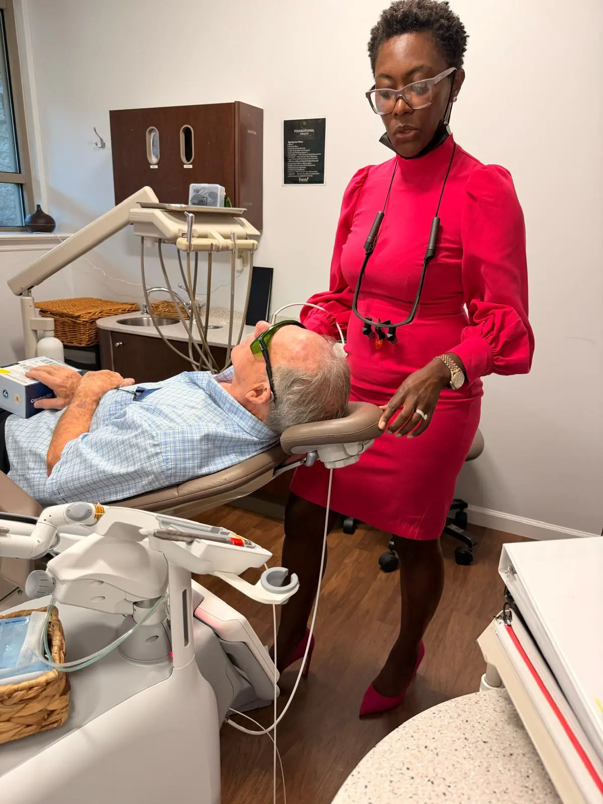 Dentist with a patient during treatment at Advanced Dentistry of Collegeville