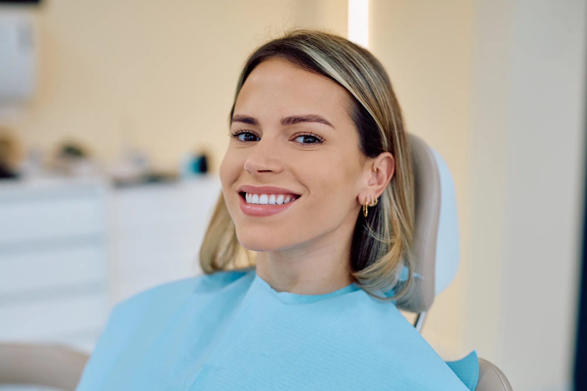 Smiling patient in a dental chair at our Collegeville office